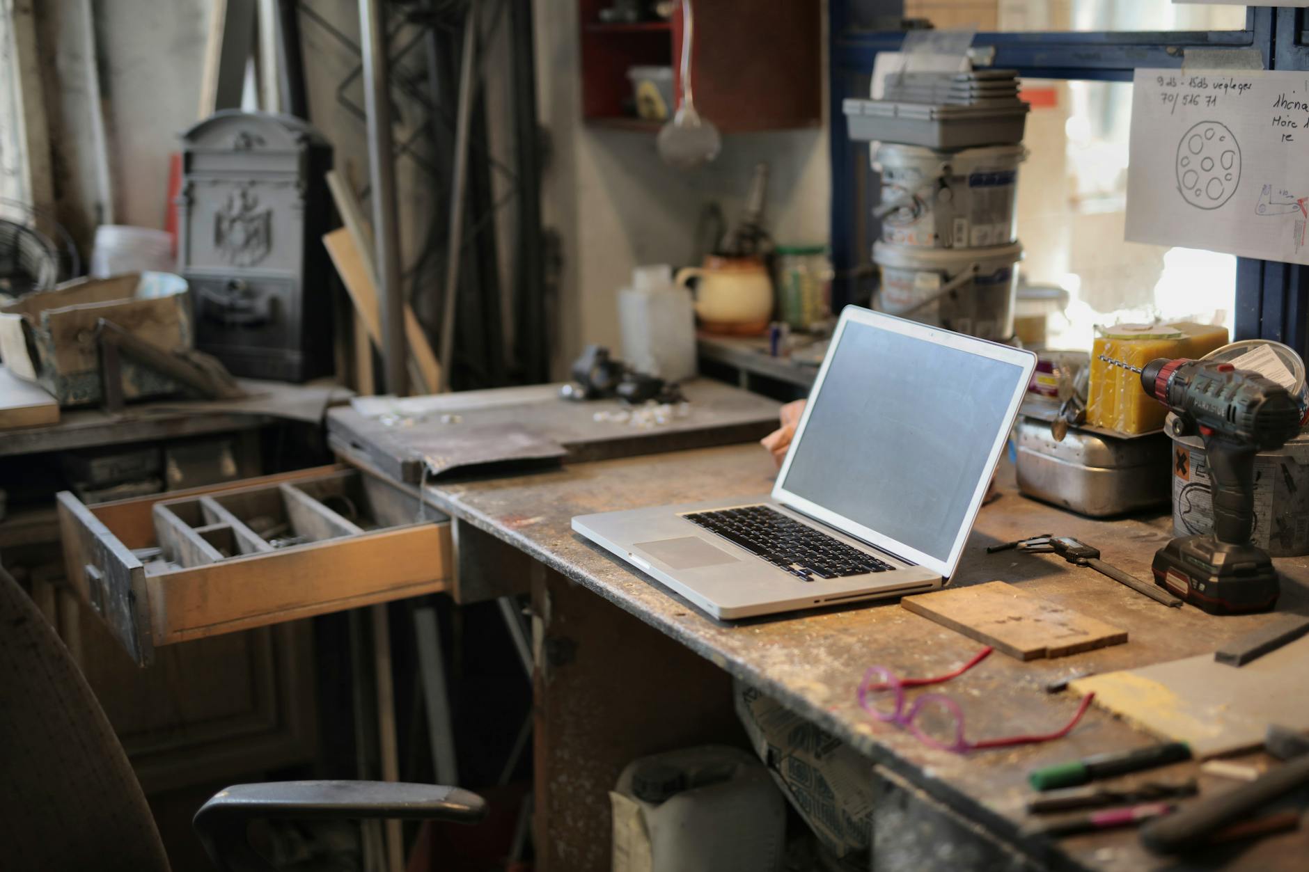 laptop on table in workshop